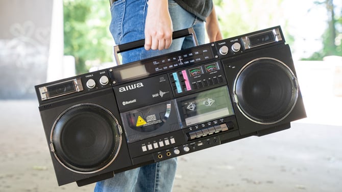 The Aiwa Retro Boombox is carried by its built-in handle