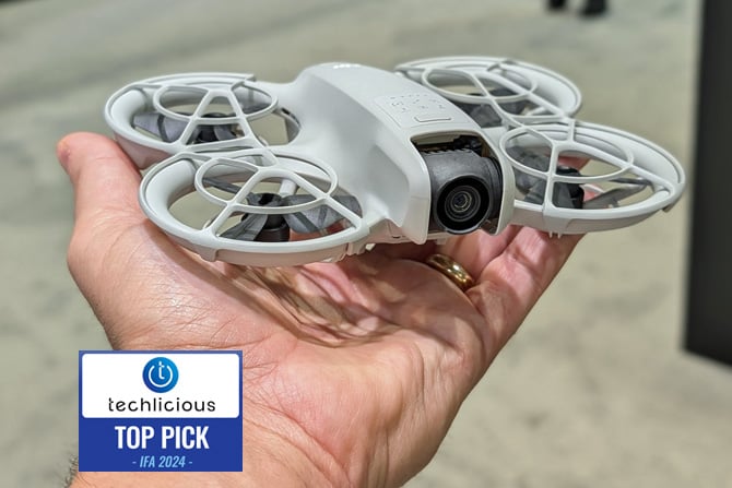 The DJI Neo camera drone is shown held in a hand. The Techlicious Top Pick Award logo is in the lower left.