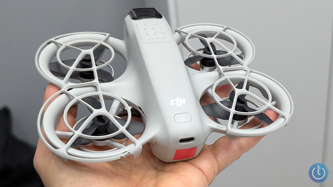 DJI Neo is held in a hand for scale