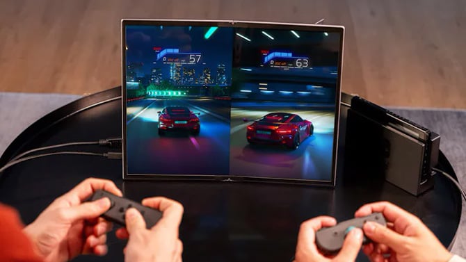 ASUS ZenScreen Fold OLED MQ17QH shown hooken up to a gaming system with two people playing