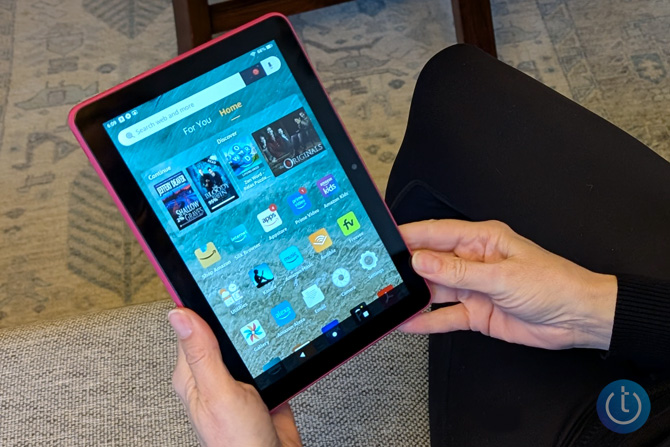 Amazon Fire HD 8 (Gen 12) is shown in hands.