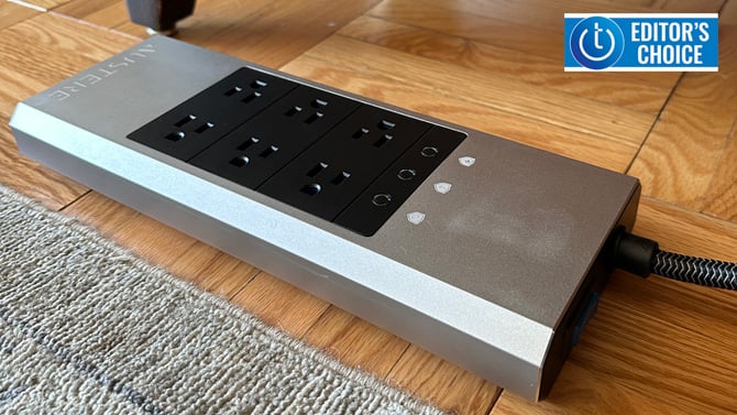 Austere VII Series 8-Outlet Surge Protector on wood flooring with the Techlicious Editor's Choice logo in the upper right