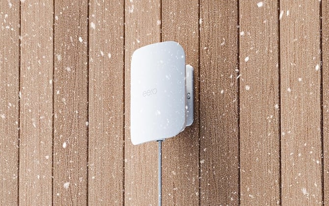 eero Outdoor 7 is shown mounted on wood.