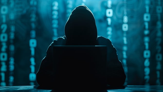Conceptual drawing showing a hacker with code in the background.