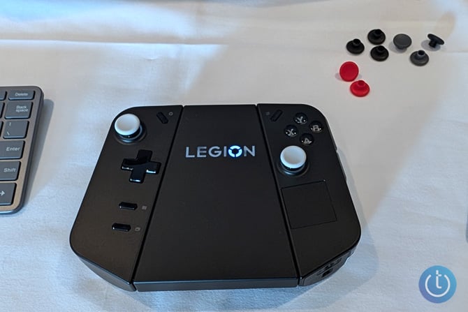 Lenovo Legion Go Connector shown with the controllers attached and the white concave caps.