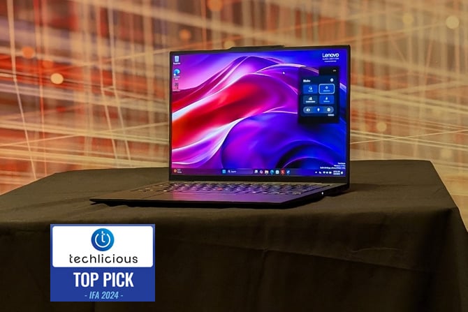 The Lenovo ThinkPad X1 Carbo Gen 13 Aura Edition is shown from the front. You can use the Aura mode panel open on the screen. The Techlicious Top Pick Award logo is in the lower left. 