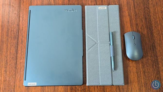 Lenovo Yoga Book 9i is shown closed with the keyboard case and mouse.