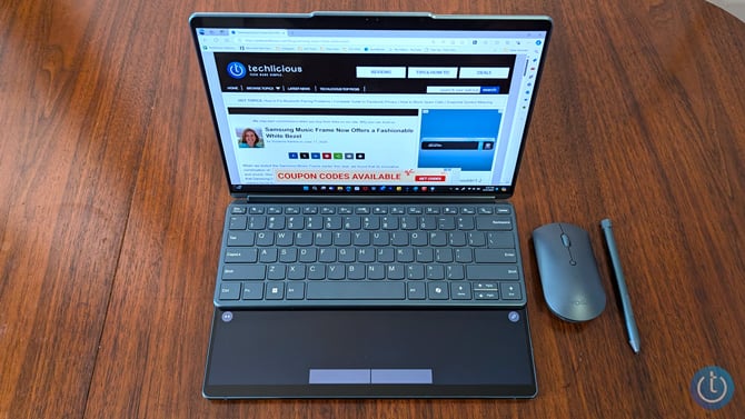 Lenovo Yoga Book 9i is shown with the Bluetooth keyboard on top of the bottom display.
