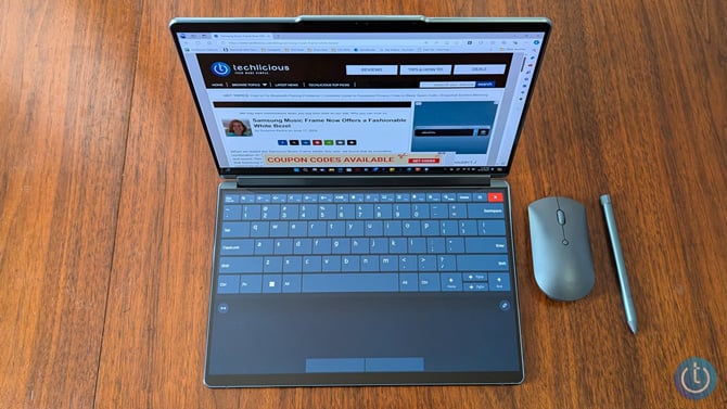 Lenovo Yoga Book 9i is shown with the virtual keyboard.
