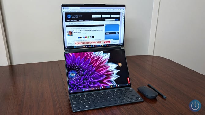 Lenovo Yoga Book 9i 2024 is shown in its stand with the displays stacked vertically. 