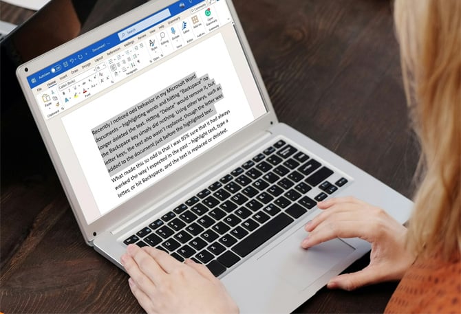 Laptop showing Microsoft Word with a paragraph of text highlighted.