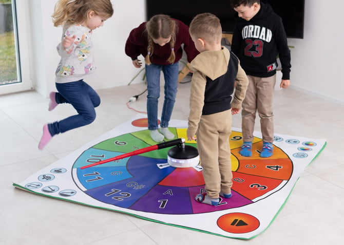 Four children are shown using the swip Spin & Play