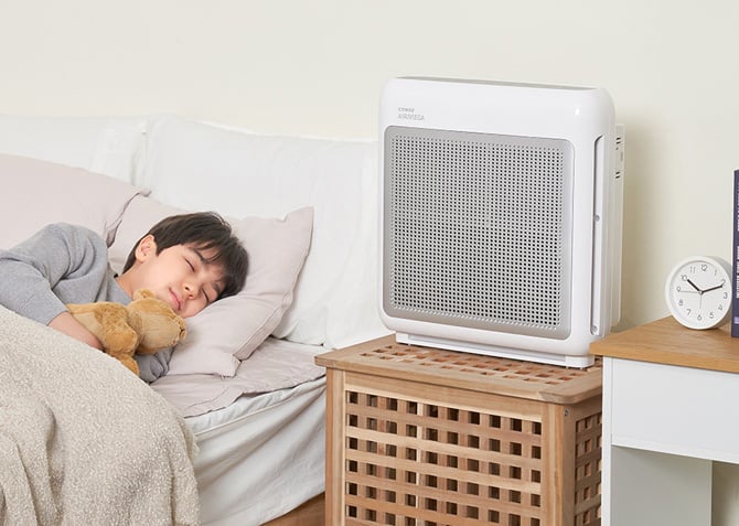 The Coway 200M Air Purifer is shown on a nightstand.