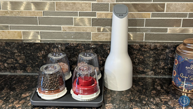 closeup of the FinaMill spice grider with filled pods on a kitchen counter