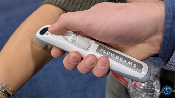 Flowbeams is shown against an arm as if injecting a solution