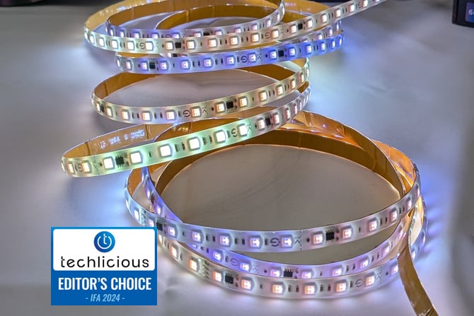  The Govee Strip Light 2 Pro is shown on a table with multple color segments. The Techlicious Editor's Choice Award logo is in the lower left.