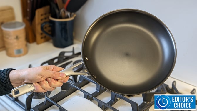 KitchenAid NITRO Carbon Steel 10-Inch Skillet is shown held over a stovetop.