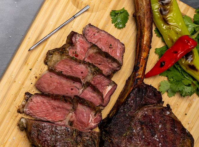 Meater Pro shown next to a sliced steak