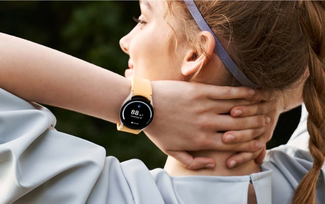 A Samsung Galaxy Watch on the wrist of a woman