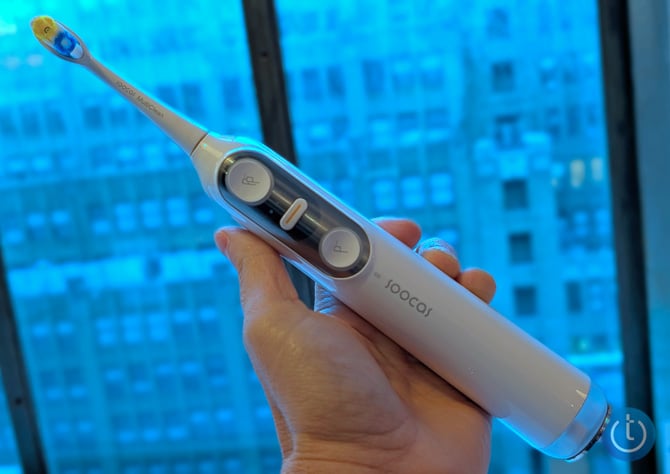 Soocas NEOS II 2-in-1 Electric Toothbrush held in a hand