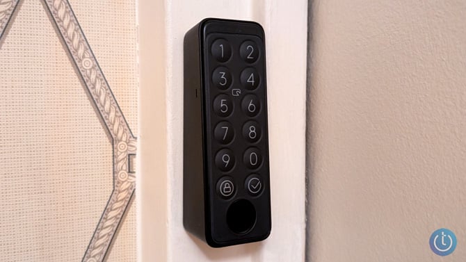 Switchbot Keypad Touch is shown mounted on a doorframe.