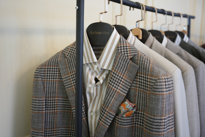 Suit jacket samples hanging on a rack