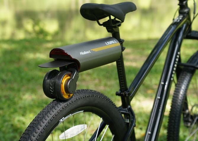 A black bicycle with the LIVALL PikaBoost 2 mounted