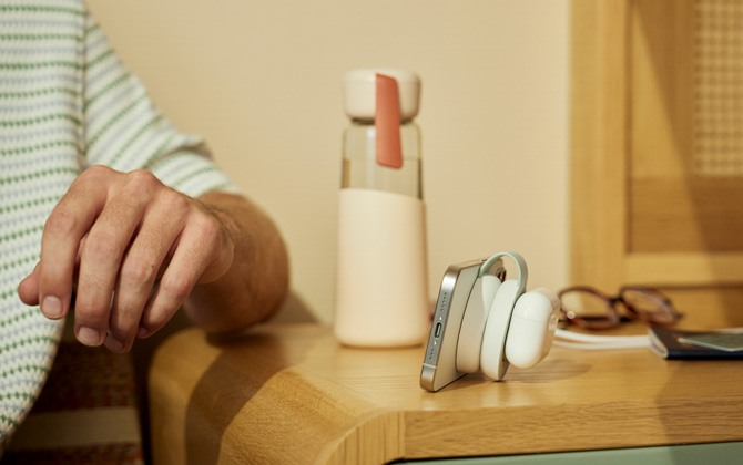 Twelve South ButterFly SE is shown in stand mode charging an iPhone and AirPods.