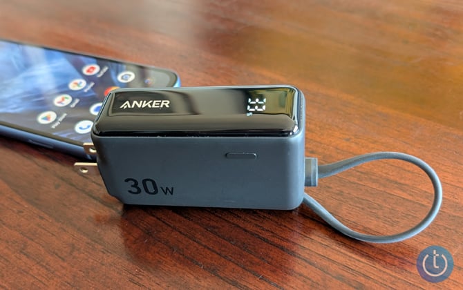 Anker 3-in-1 Power Bank is shown plugged into an Android phone.