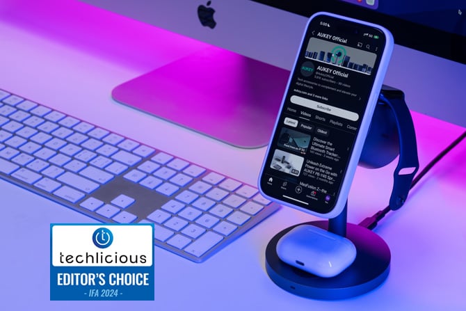  AUKEY MagFusion 3-in-1 Pro is shown with an iPhone, AirPods, and Apple Watch charging. The Techlicious Editor's Choice Award logo is in the lower left.