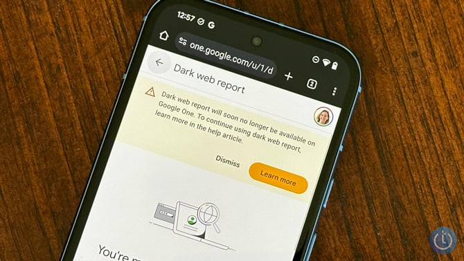 Phone shows a screenshot of the alert from Google annoucing that the Dark Web Report won't be available to Google One subscribers.