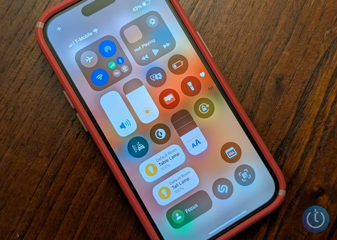 Screenshot of iOS 18 Control Center is shown on an iPhone