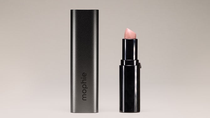 The Mophie Powerstation Mini stands next to a tube of lipstick