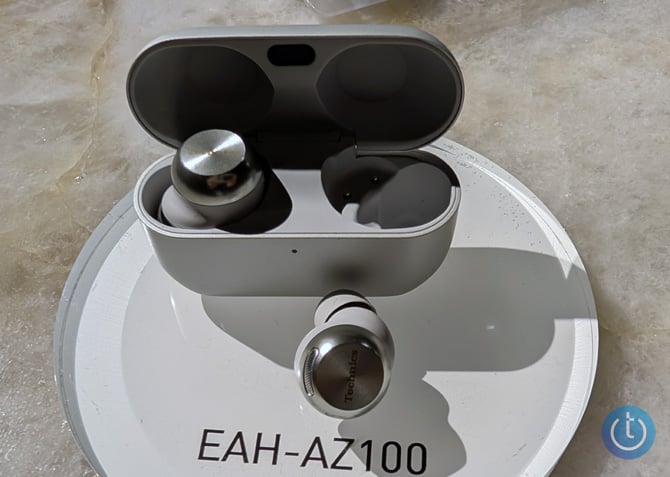 The Technics EAH-AZ100 true wireless earbuds are shown with their case.