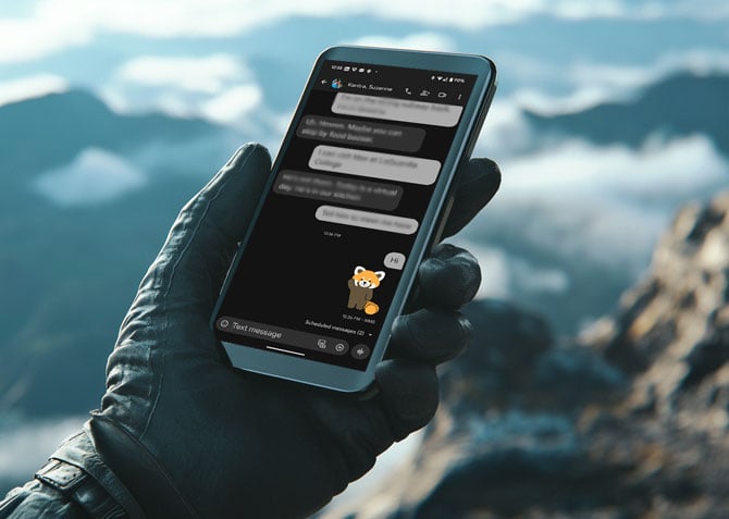 Concept of texting from the top of a mountain.